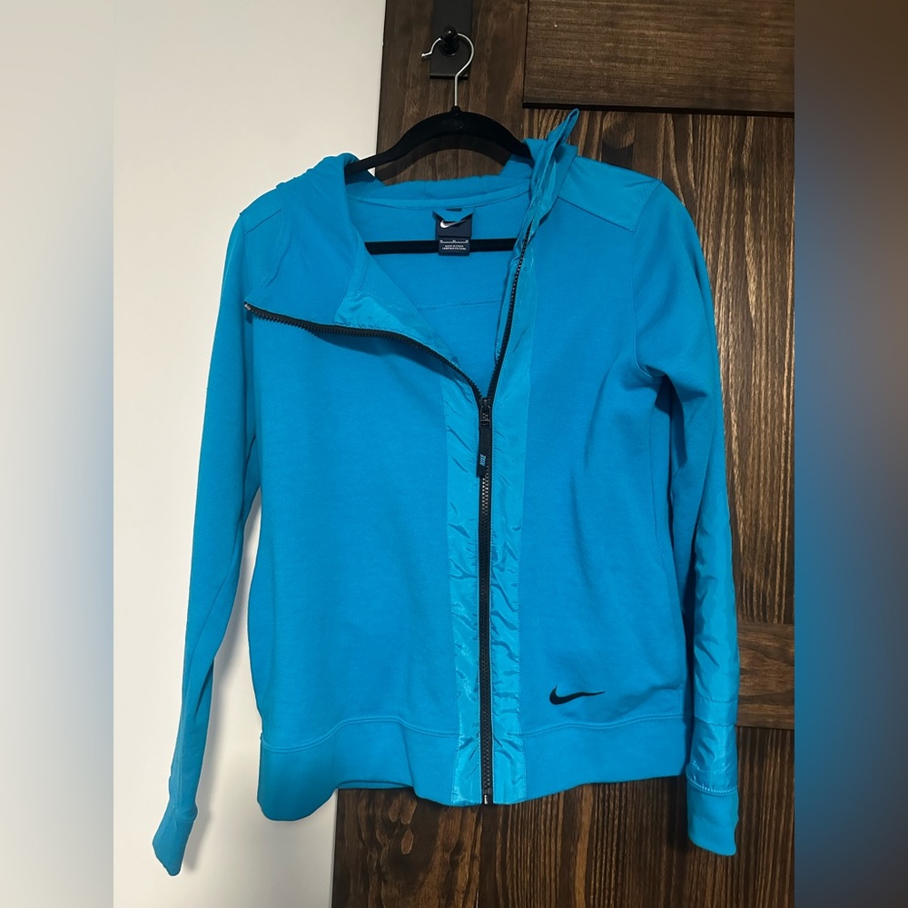 Bright Blue Nike Zip up, hooded jacket. Black detail. Only worn a couple times.